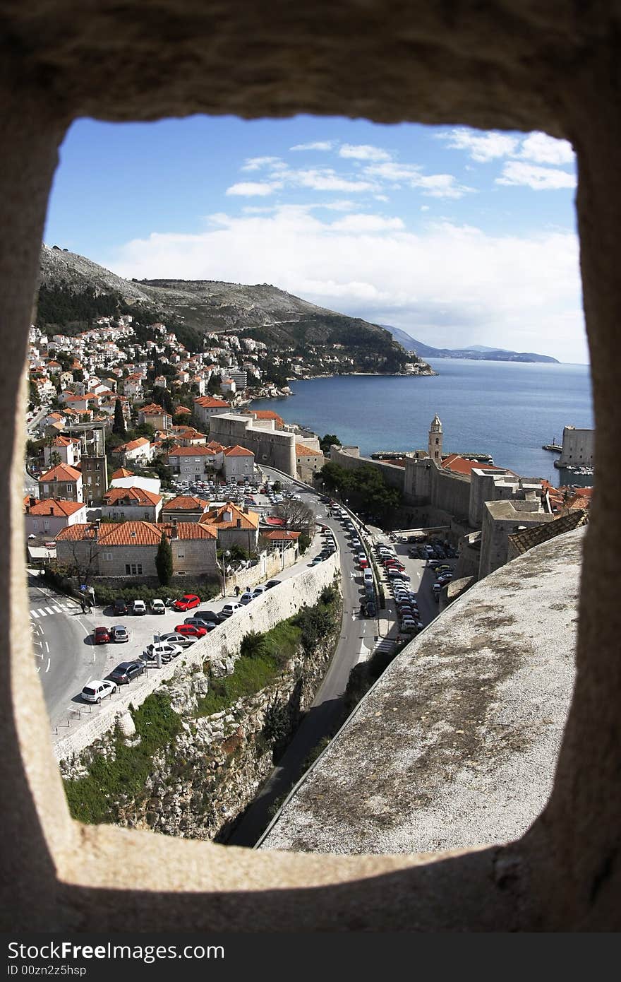 Looking out into panorama of Dubrovnik through a port hole from the old fortress (Croatia)