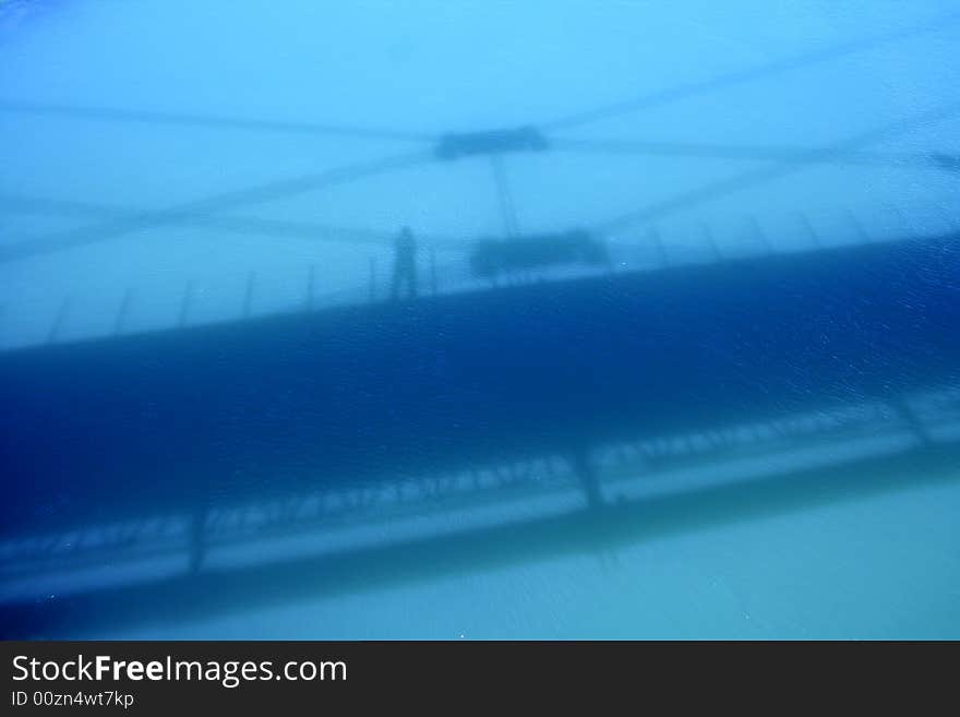 Bridge's shadow on the Euphrates river. Bridge's shadow on the Euphrates river