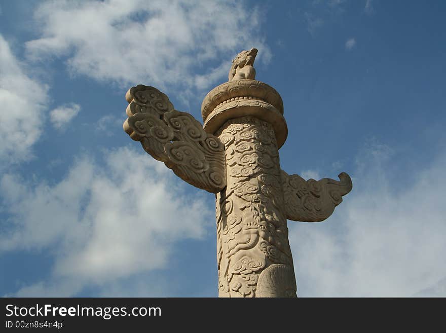 Beijing's Tian'anmen, literally, Gate of Heavenly Peace, was the principal entry to the Imperial Palace during the Ming and Qing dynasties in China's history. It is one of the finest monumental gates in the world, extraordinary for its imposing size. cloud pillar (ornamental column), stone lions and white marble bridges decorate the front. One of the more unusual features of Tian'anmen is a pair of 10-meter-high white marble columns (Cloud Pillars) topped by a dish for collecting dew. A carved stone animal known as a heaven-gazing hou(a small, lion-like legendary creature) squats inside each dish. These dishes were used to catch the jade dew imbibed by the emperor to ensure long life. According to the legend. The heaven-gazing hou watched over the emperor's activities when he was away from the palace, hoping he would not overindulge in his pleasures.