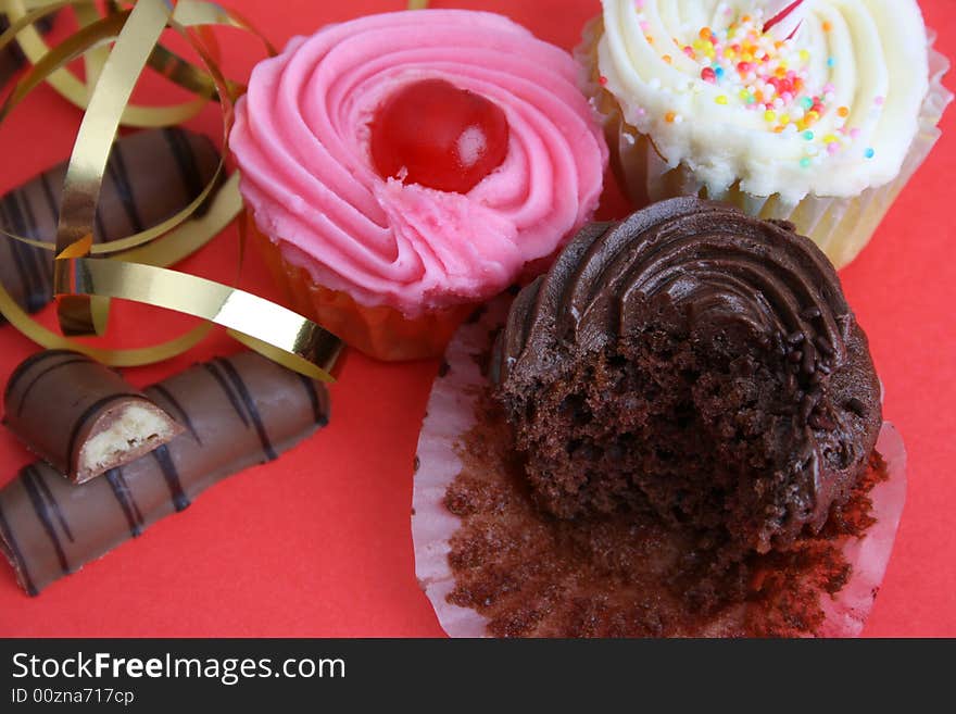 Birthday Cupcakes and chocolate sticks with gold ribbon