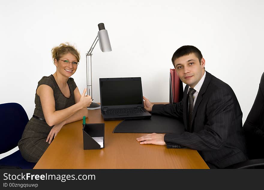 Businesswoman and businessman in office. Businesswoman and businessman in office.