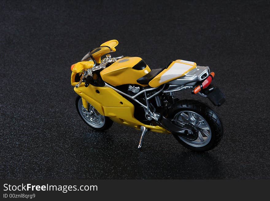 A yellow superbike scale model.