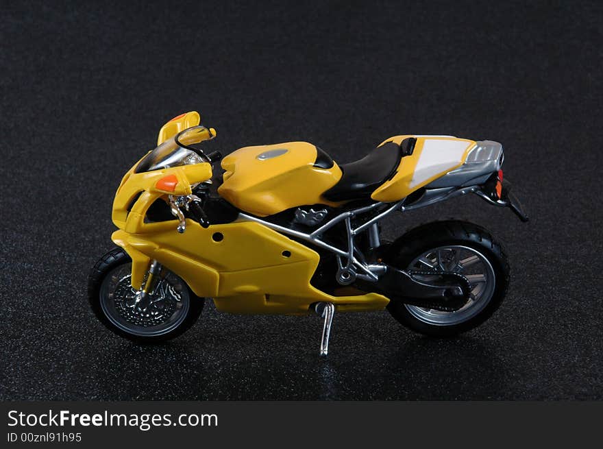 A yellow superbike scale model.