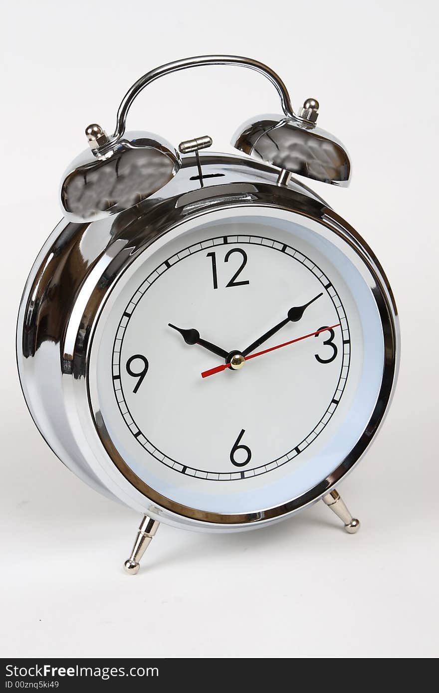 Photo of a chrome analog alarm clock