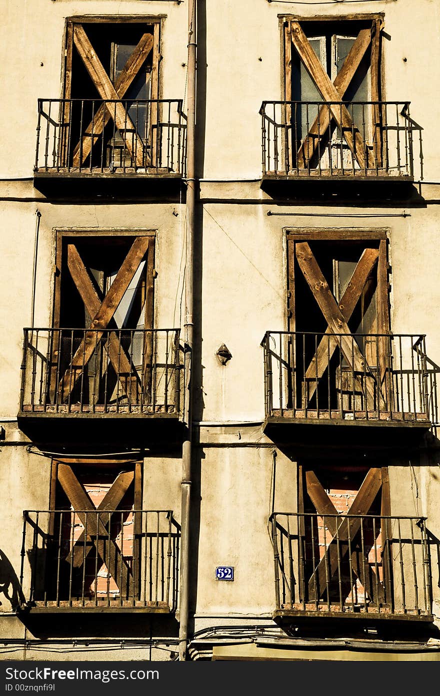 Sealed windows in old deteriorated facade. Sealed windows in old deteriorated facade.