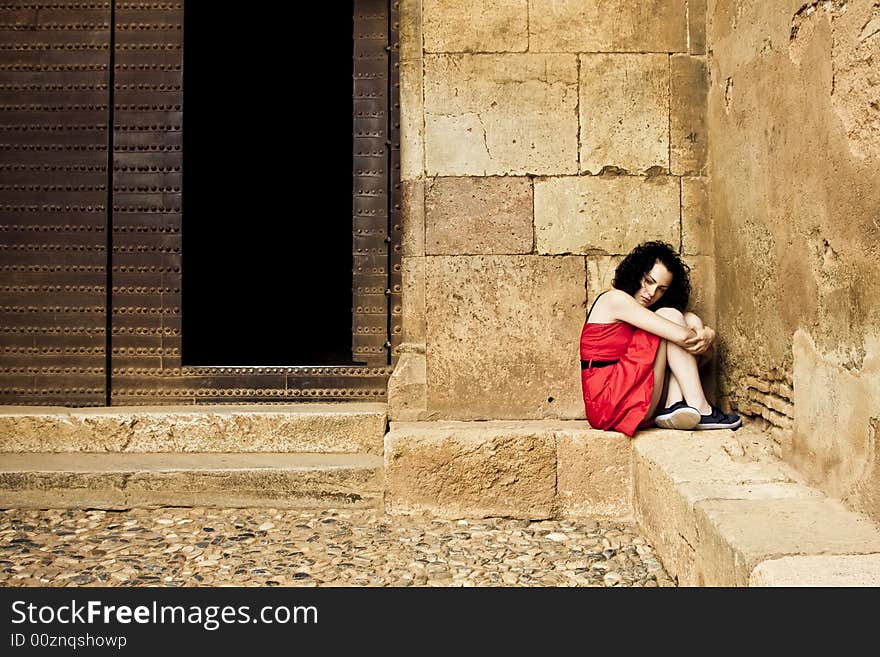 Sad young woman in a corner. Sad young woman in a corner