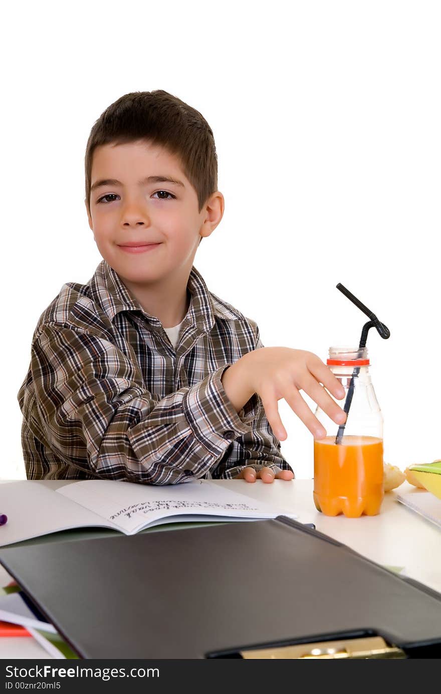 Happy smiling young boy doing studying and homework. Happy smiling young boy doing studying and homework