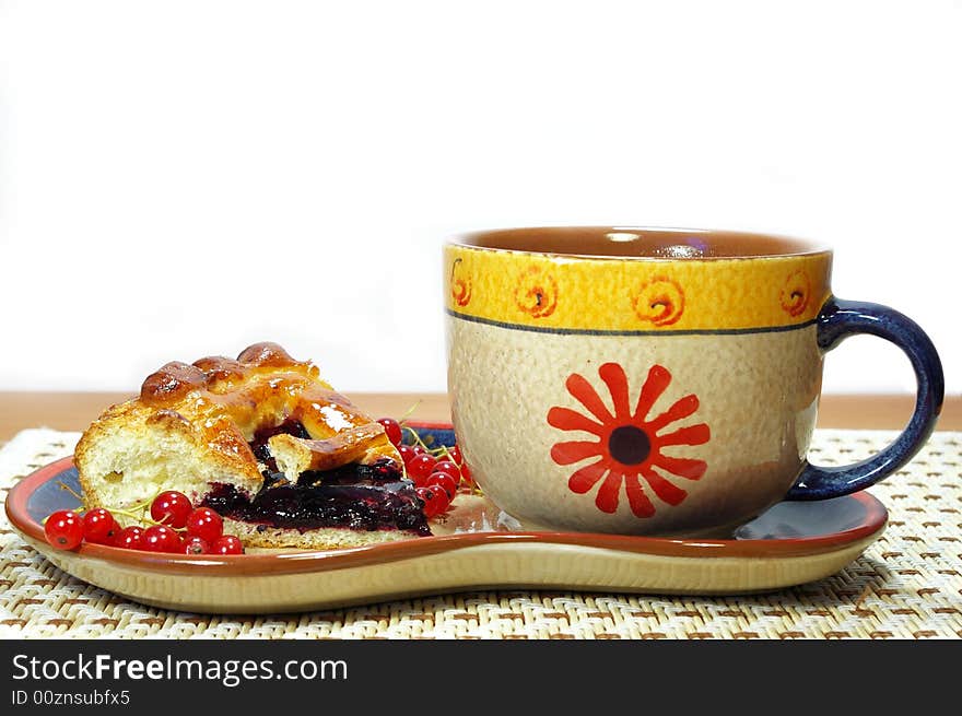 Fresh sweet pie with bilberry and cup of tea