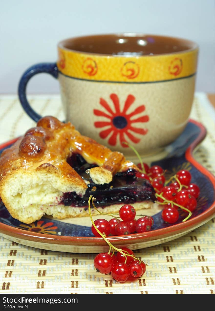 Fresh sweet pie with bilberry and cup of tea. Fresh sweet pie with bilberry and cup of tea