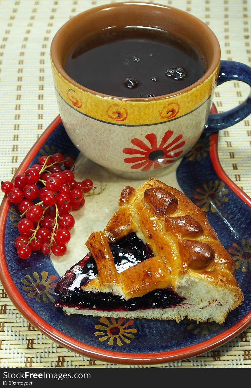 Fresh sweet pie with bilberry and cup of tea. Fresh sweet pie with bilberry and cup of tea