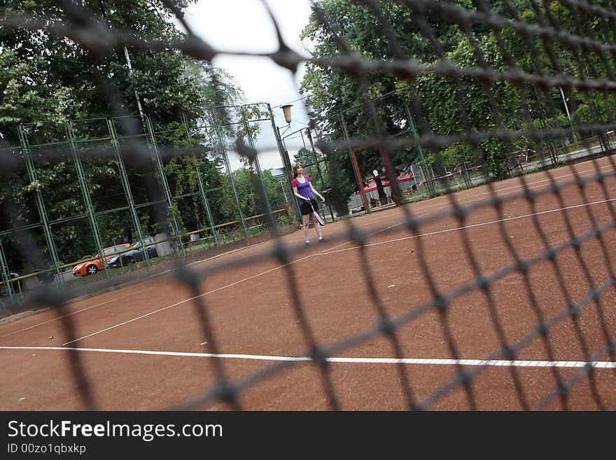 A tennis player in the game. A tennis player in the game