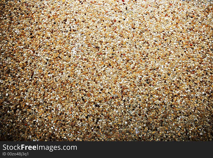 Close up of small pebbles in concrete. Close up of small pebbles in concrete.