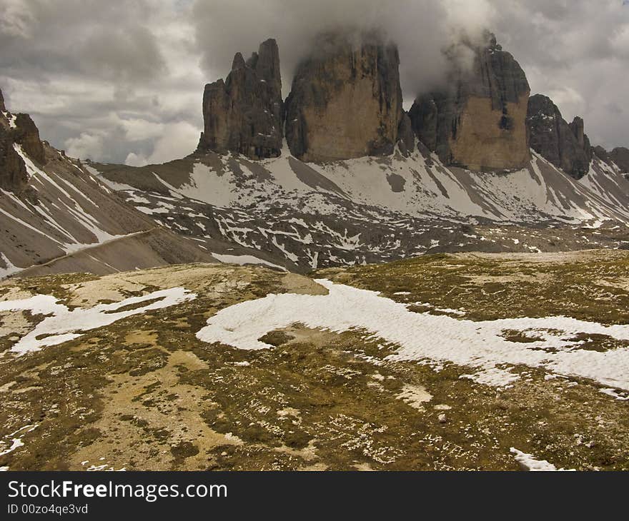 Tre Cimes in Italy, dolomites, just coming out of the clouds. Tre Cimes in Italy, dolomites, just coming out of the clouds.