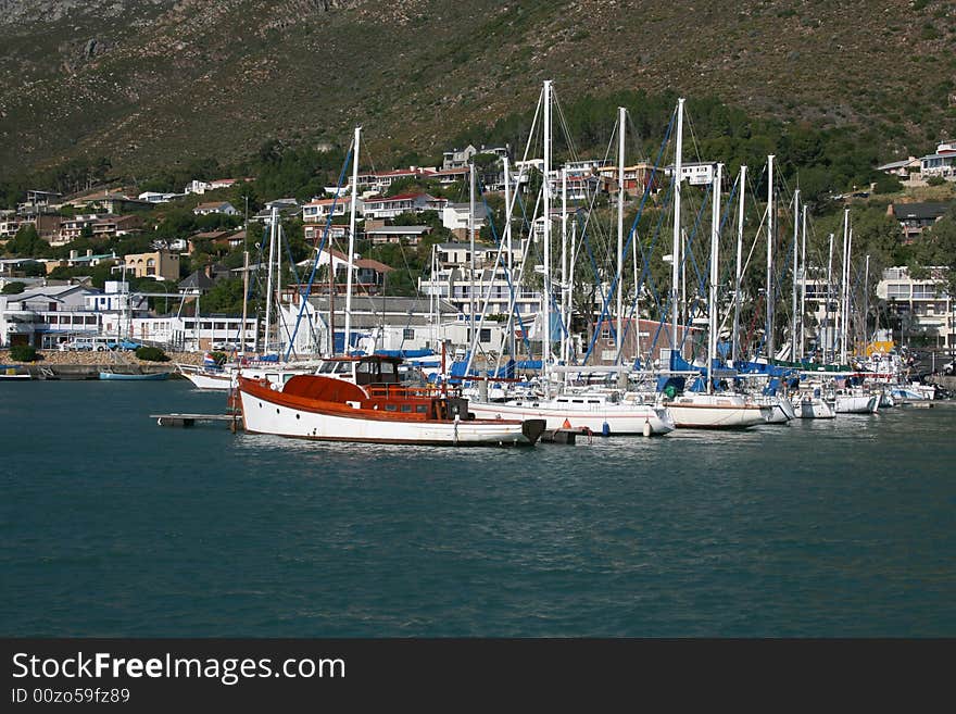 Gordons Bay Harbour in South Africa with boats lined up