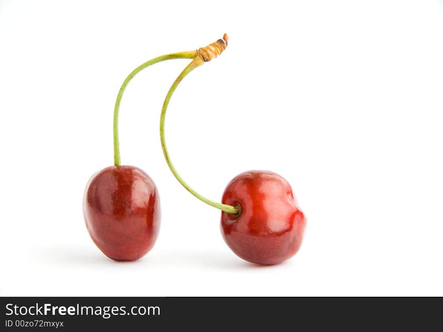 Two cherries isolated over white background. Two cherries isolated over white background