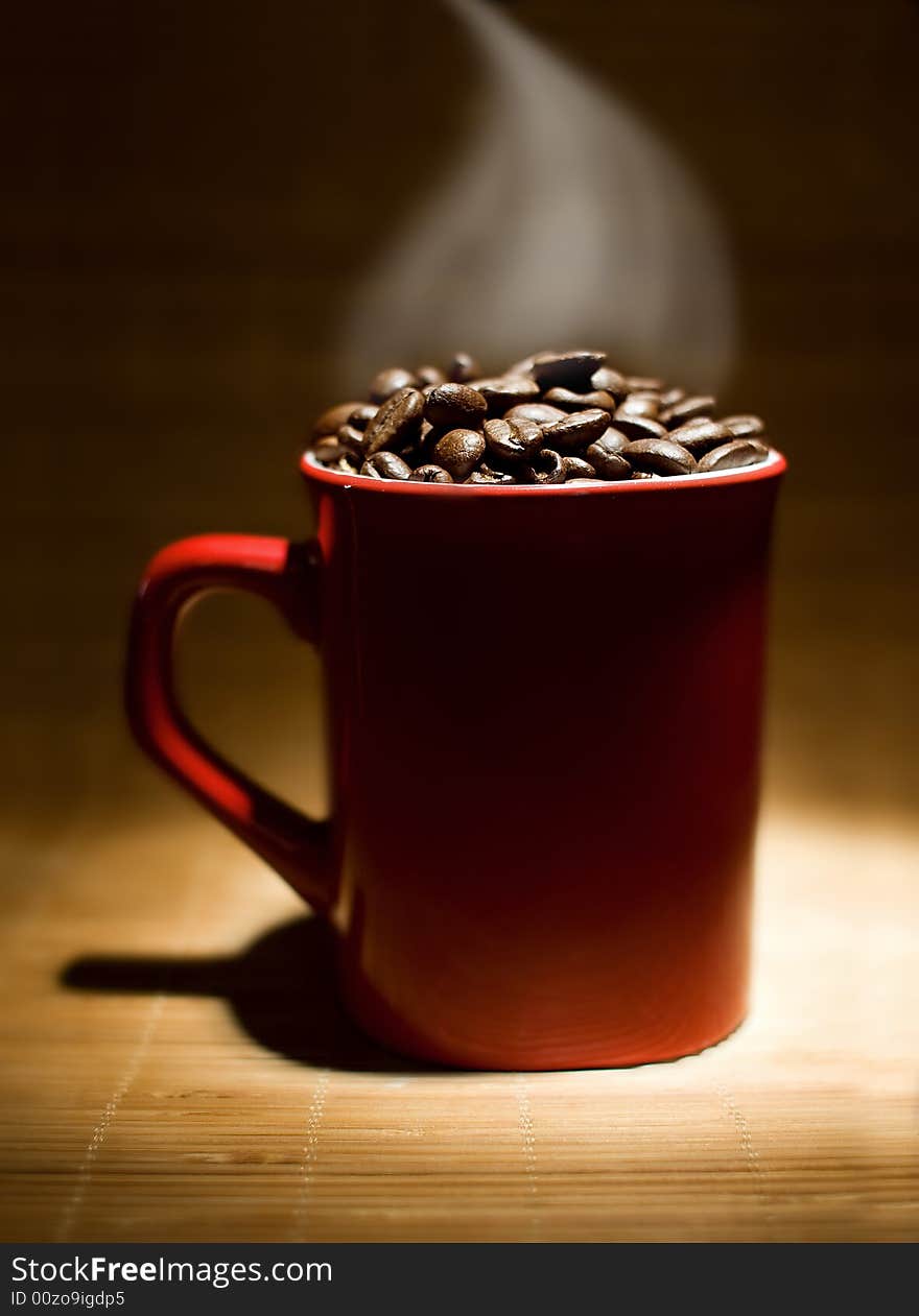 A cup filled with coffee beans