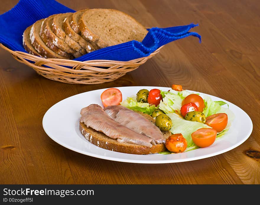 Haring with salad and bread. Haring with salad and bread.