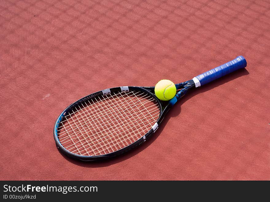 Tennis racket and ball