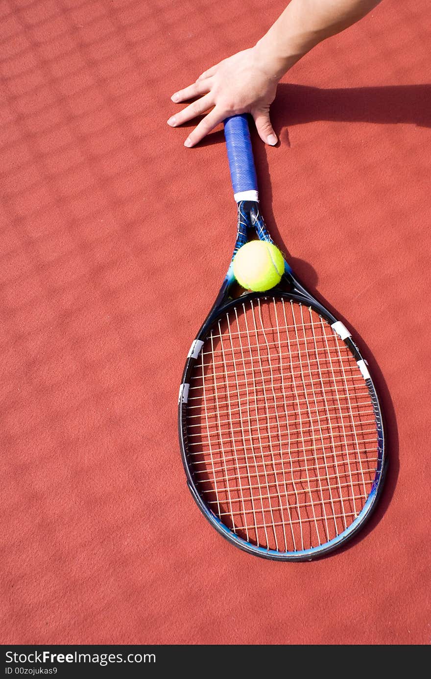 Tennis ball and racket