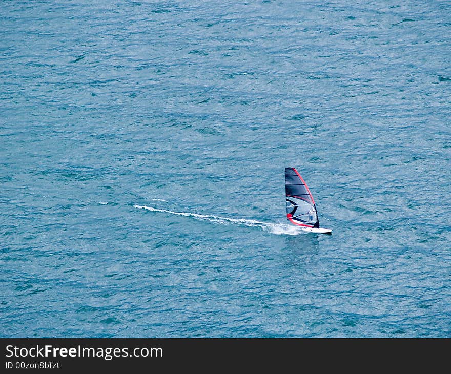 Windsurfing on lake garda - italy - cloudy day. Windsurfing on lake garda - italy - cloudy day