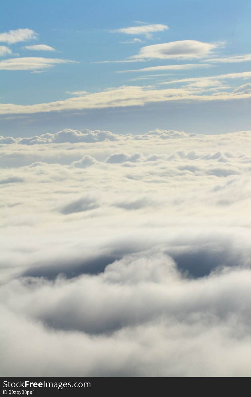 A picture of fog taken from the top of a mountain. A picture of fog taken from the top of a mountain.