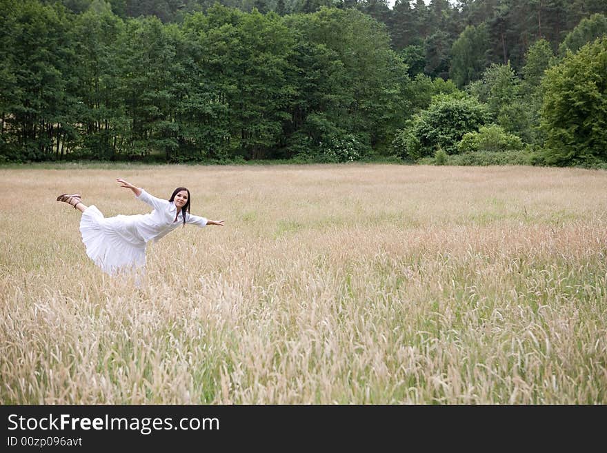 Happy woman jumping on green meadow. Happy woman jumping on green meadow