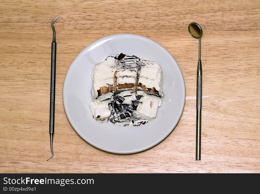 Breakfast - icecream in the plate and dental instruments. Breakfast - icecream in the plate and dental instruments