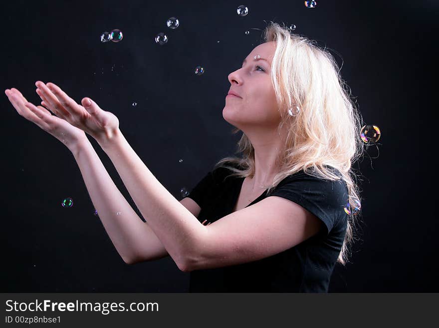 Photo of attractive woman on black background with boubles. Photo of attractive woman on black background with boubles