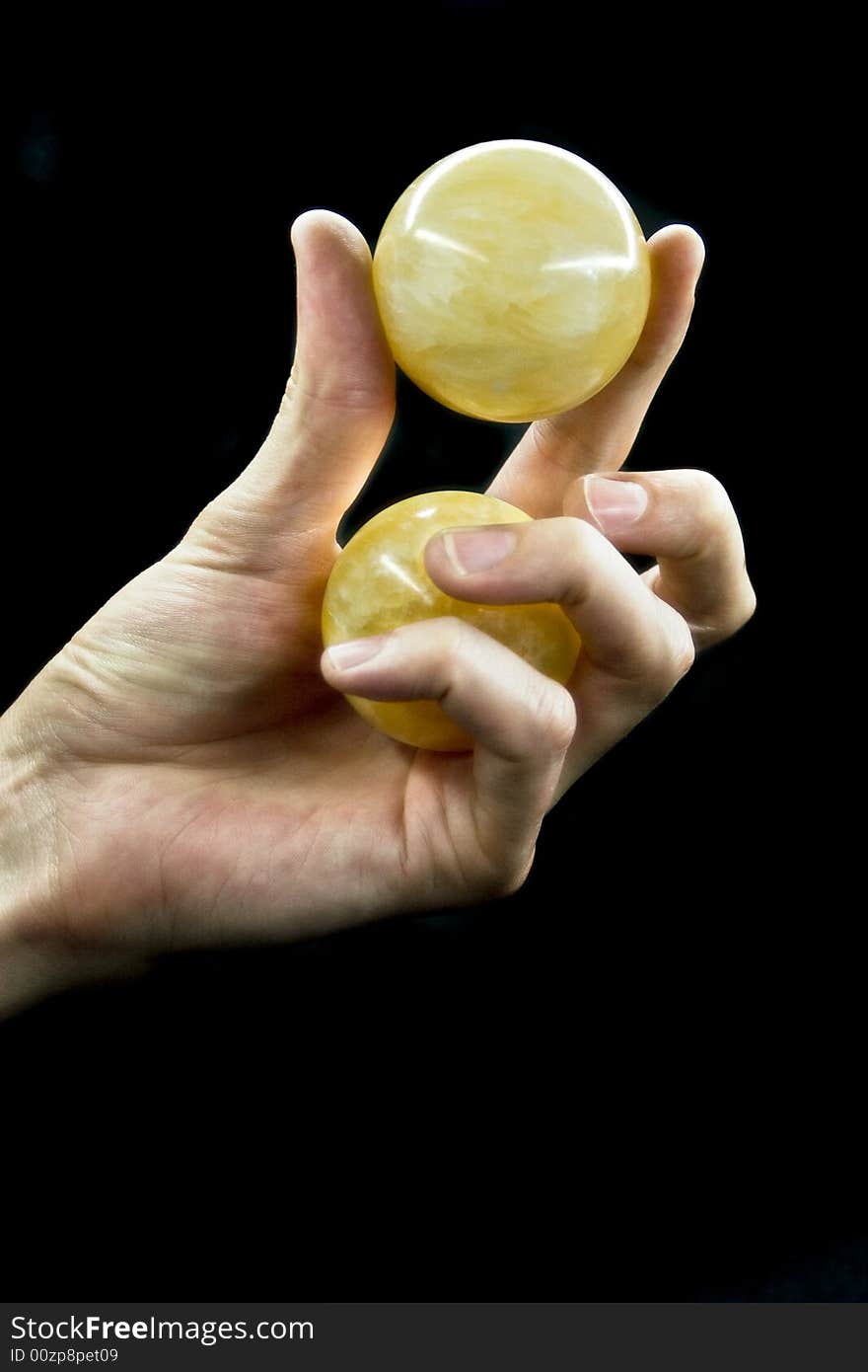 Hand with the ball on a black background. Hand with the ball on a black background