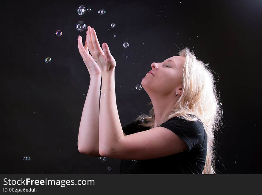 Photo of attractive woman on black background with boubles. Photo of attractive woman on black background with boubles