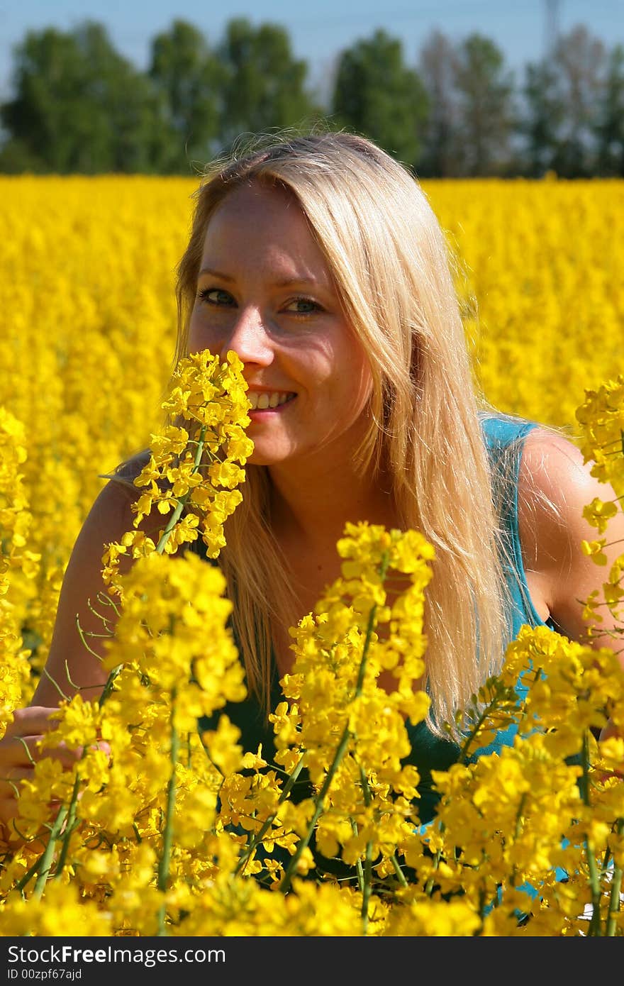 Photo of attractive woman in yellow flowers