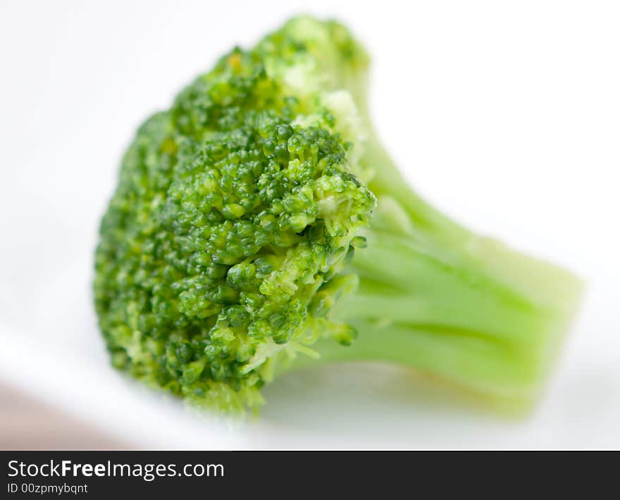 Fresh broccoli in the dish close up