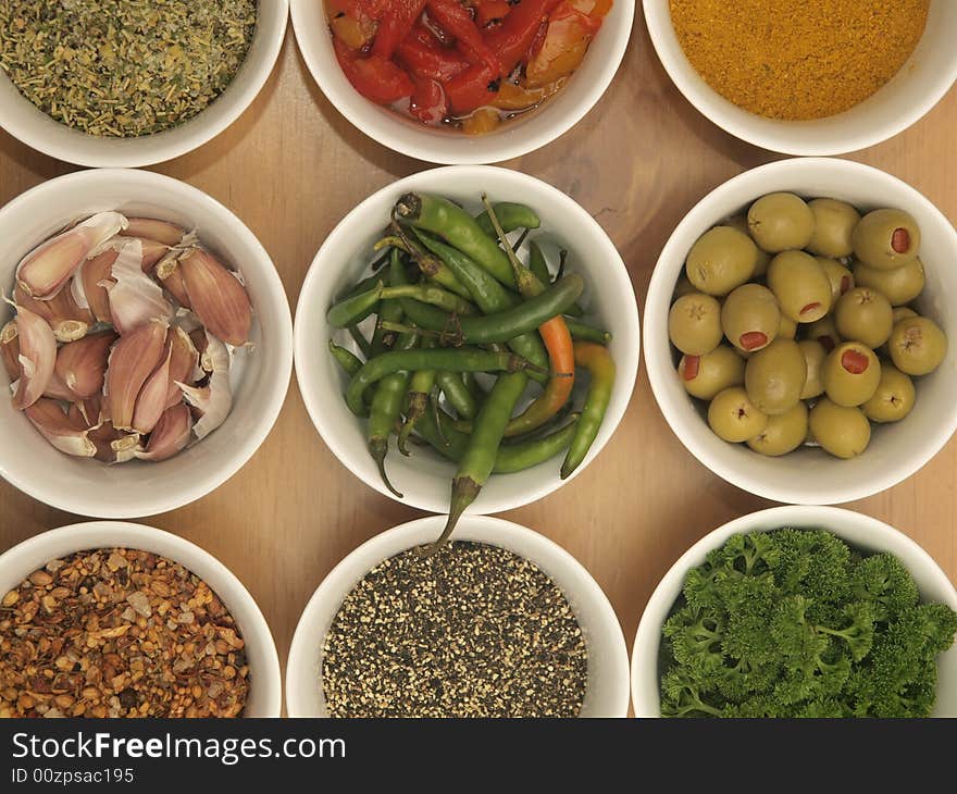 Nine bowls with an assortment of ingredients. Nine bowls with an assortment of ingredients