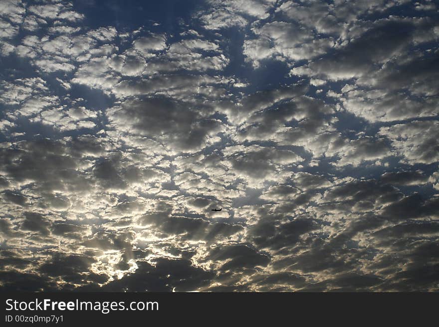 Clouds and airplane