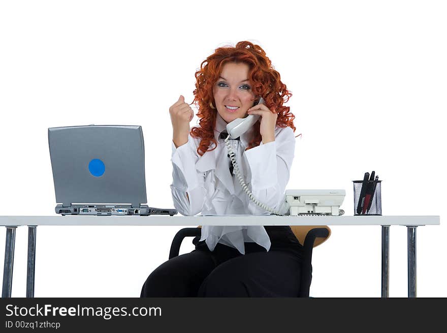 Beautiful young businesswoman calling in office