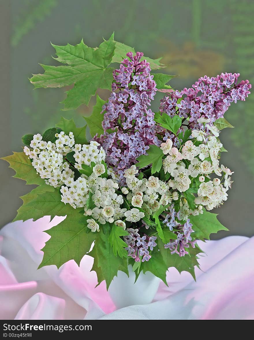 Lilac and tiny white flowers in vase. Lilac and tiny white flowers in vase