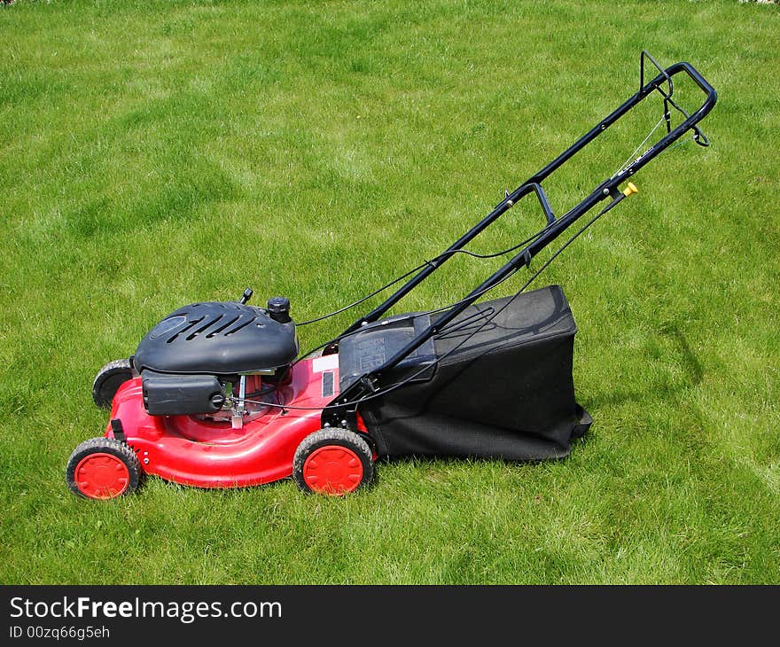 Lawn mower in grass