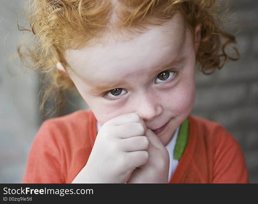 Portret of a beautiful little girl with red hair. Portret of a beautiful little girl with red hair.