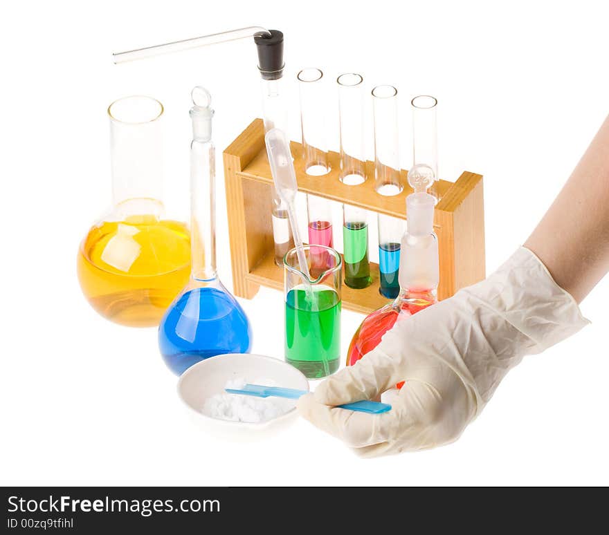 Various colorful glass laboratory ware on a white background. Various colorful glass laboratory ware on a white background