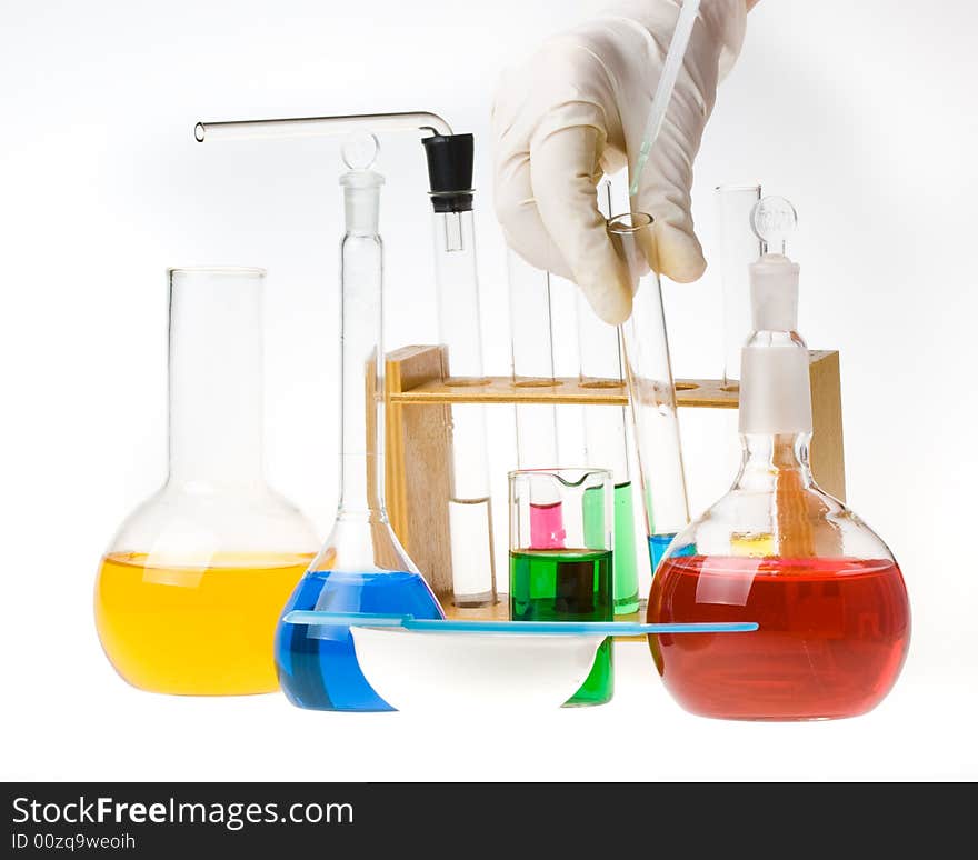 Various colorful glass laboratory ware on a white background. Various colorful glass laboratory ware on a white background