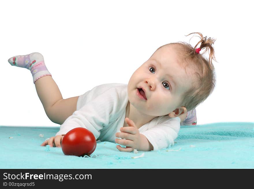 The little girl with a tomato. The little girl with a tomato