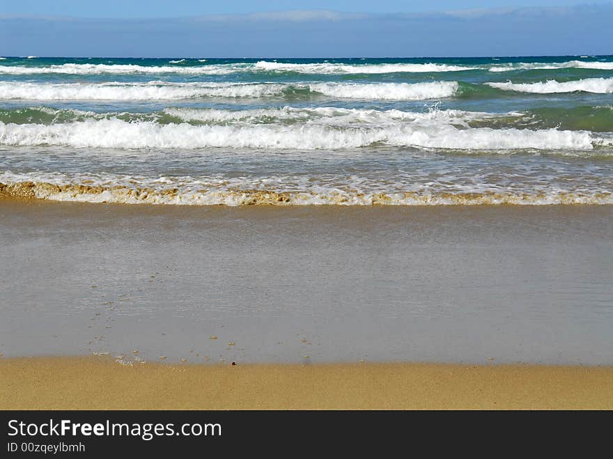 Beach sand wave and blue sky