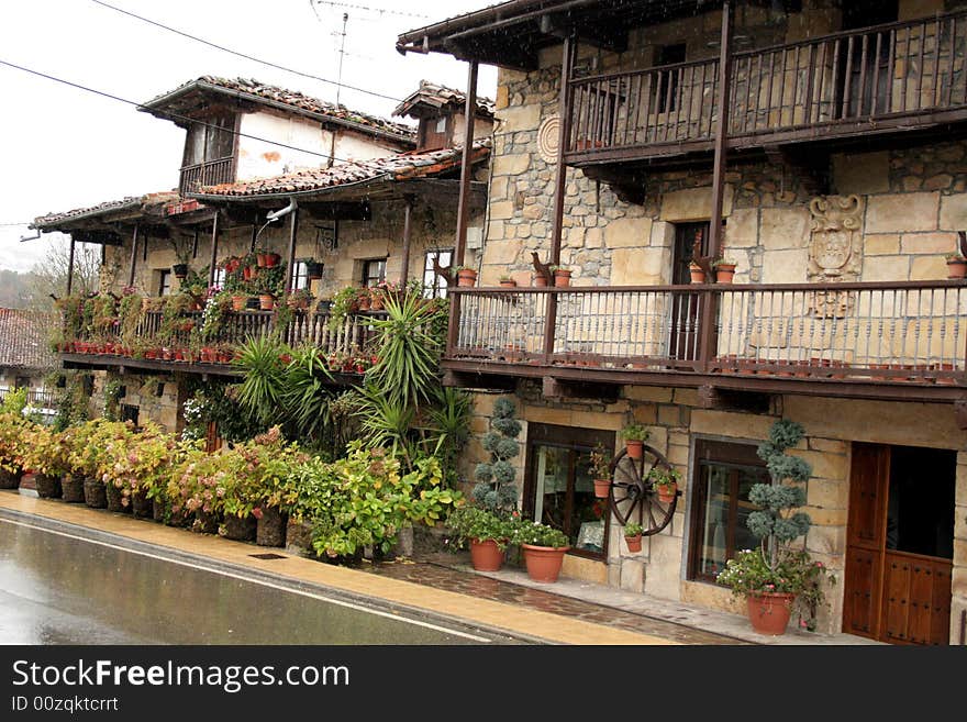 Stone picturesques houses with lots of flowers in village Villacariedo, Cantabria. Stone picturesques houses with lots of flowers in village Villacariedo, Cantabria