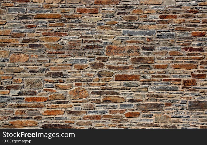 Stone wall of a mediterranean town, background texture