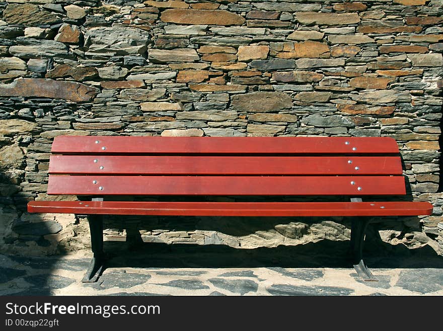 Stone wall, red bank, stone floor, relax on a sunny day. Stone wall, red bank, stone floor, relax on a sunny day