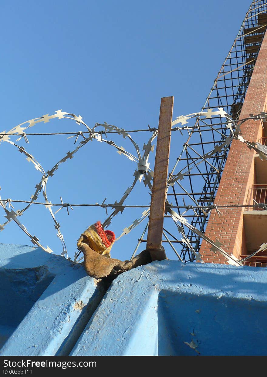 Fence with a barbed wire. Construction.