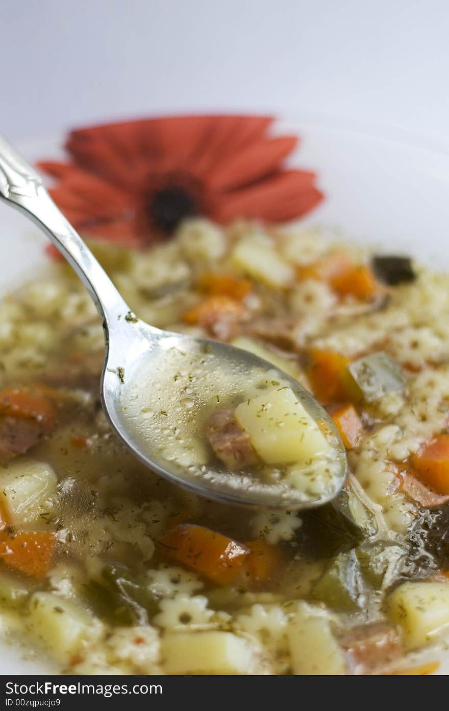 Soup and spoon in cymbal