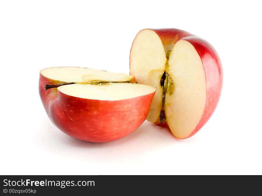 Two red apple halves isolated on the white background