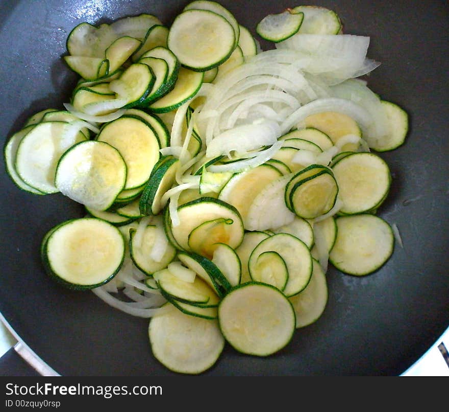 Zucchini and onion cooking