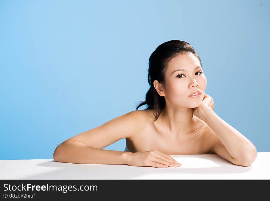 Refreshing and clean face of young woman face leaning on hand. Refreshing and clean face of young woman face leaning on hand